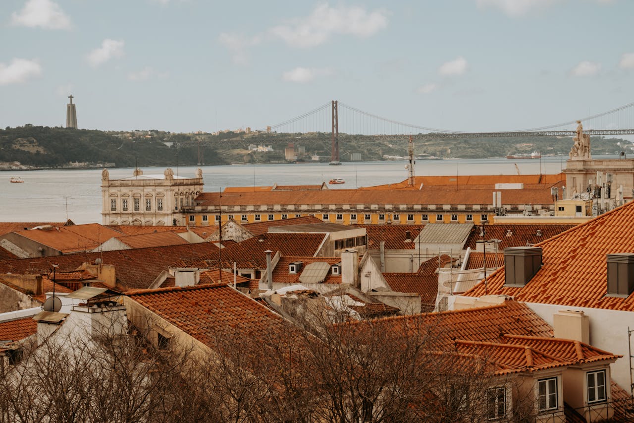Lisbon scenic viewpoint with rooftops and river